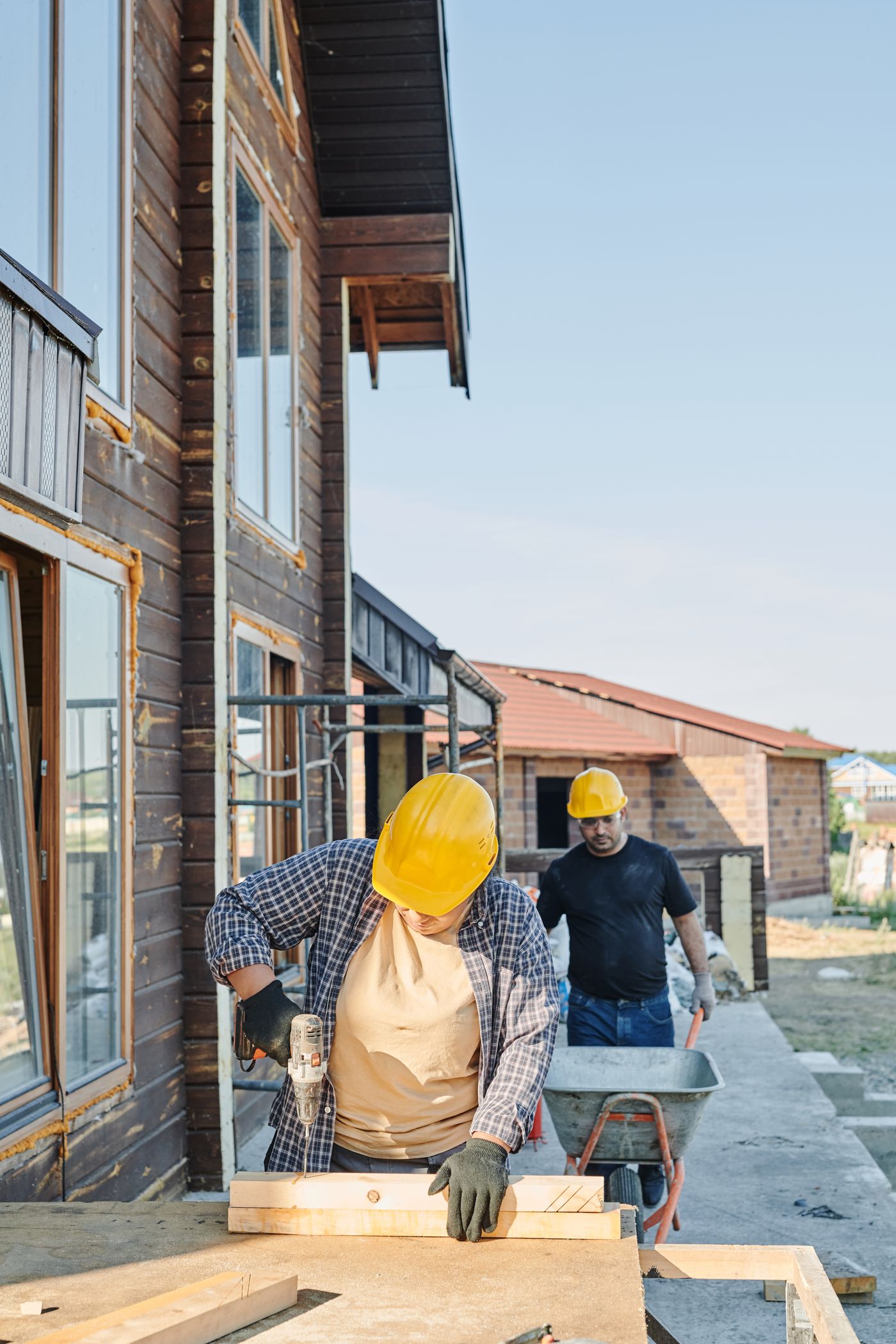Skilled construction workers building a timber structure
